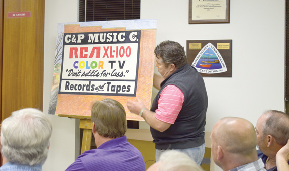 Downtown folk art sign restored