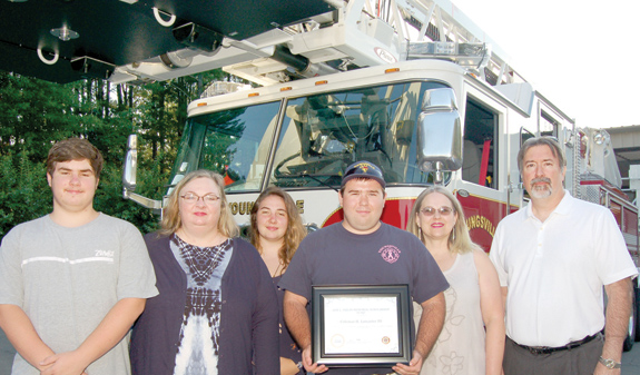 <i>Honoring a fireman by helping another</i>